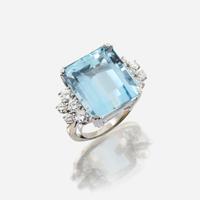 An aquamarine, diamond, and eighteen karat white gold ring