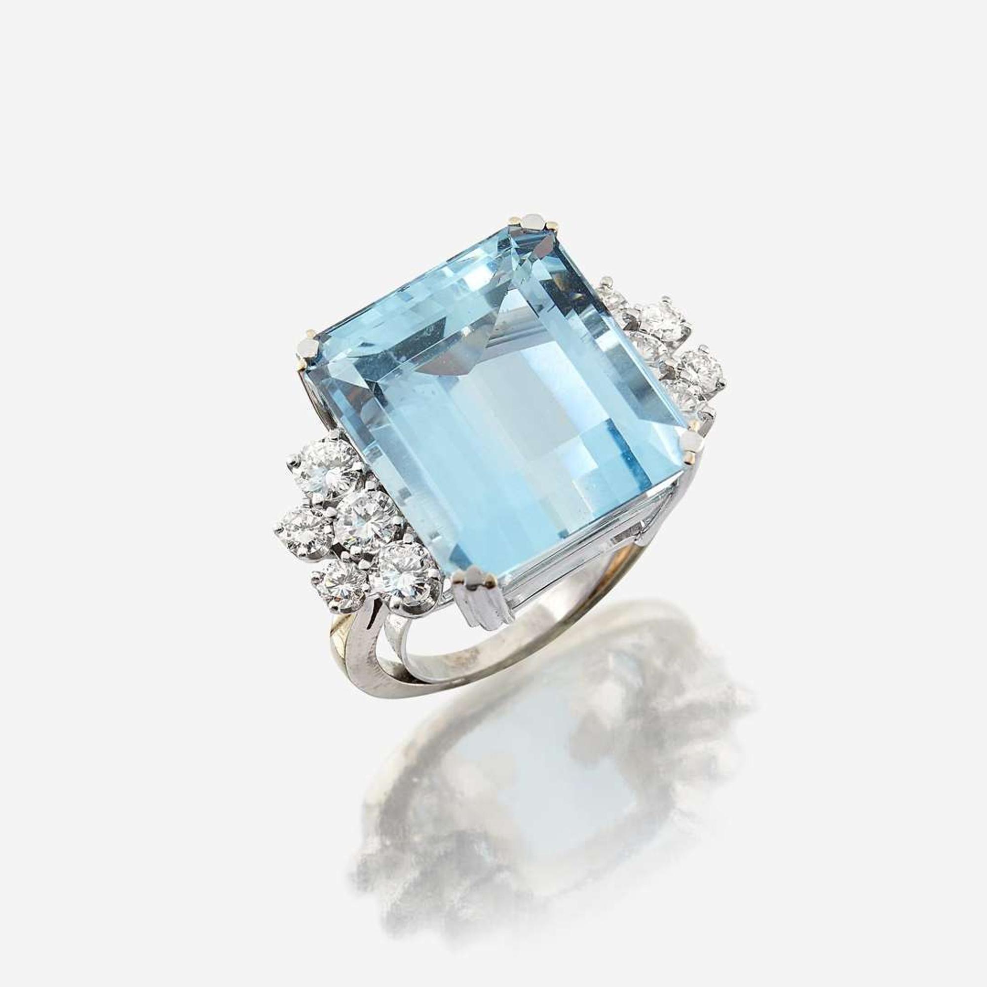 An aquamarine, diamond, and eighteen karat white gold ring