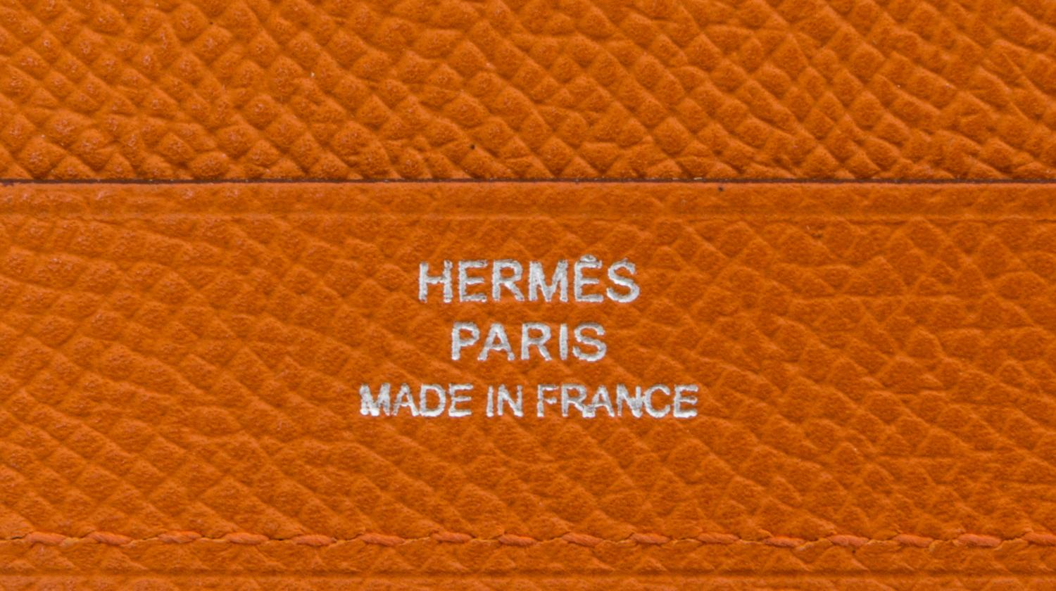 An Hermes Orange Leather Folio, 9" x 12.5" x .25".