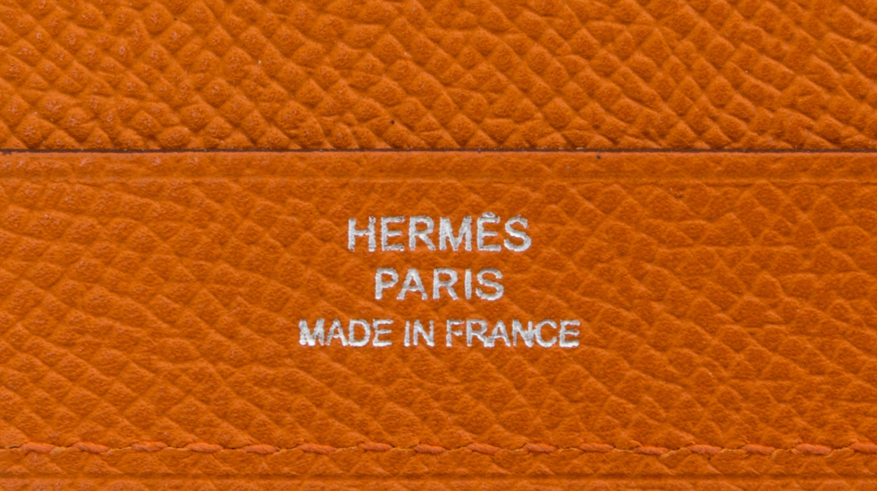 An Hermes Orange Leather Folio, 9" x 12.5" x .25".