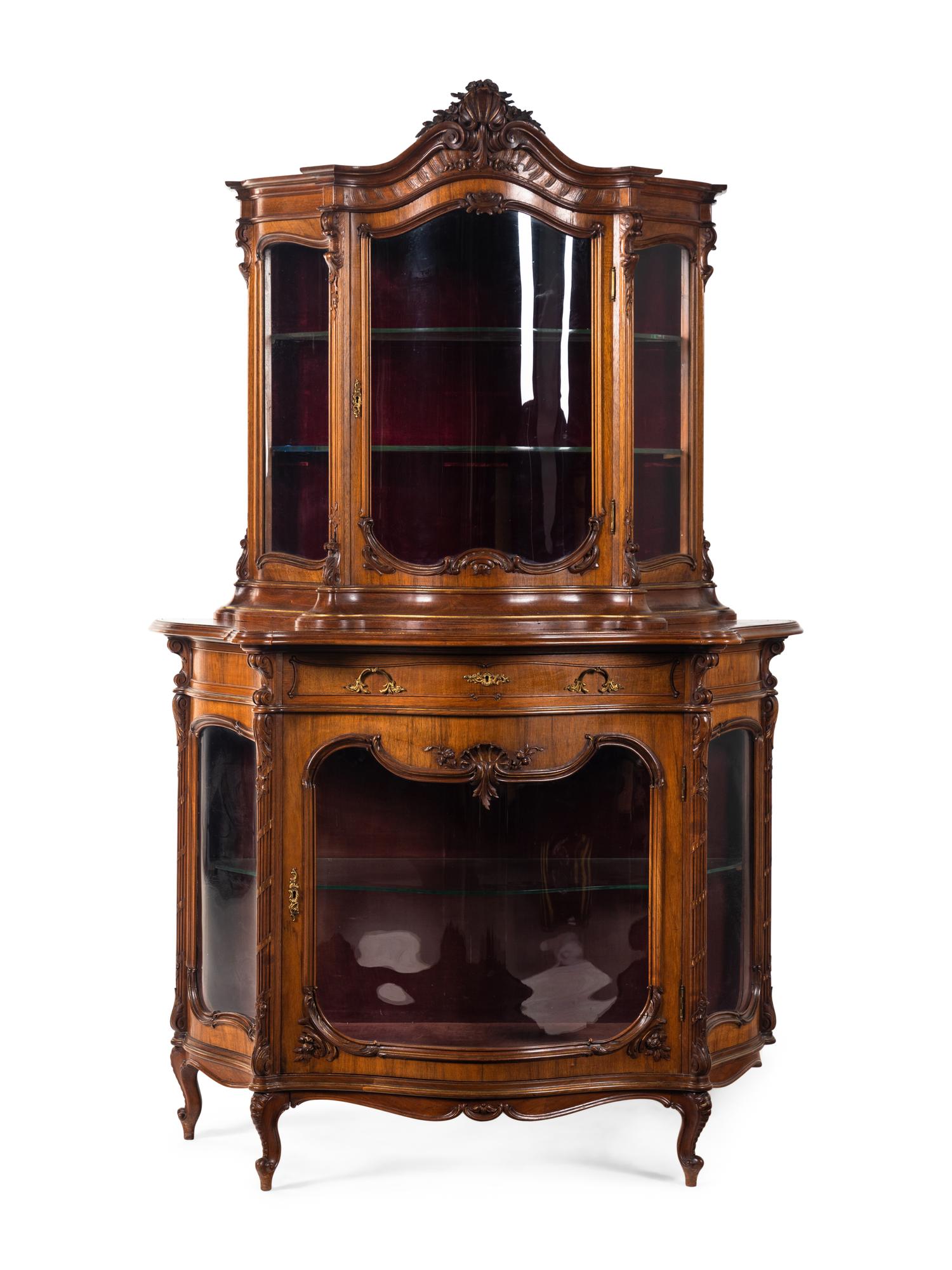 A Rococo Revival Carved Walnut Corner Vitrine Cabinet