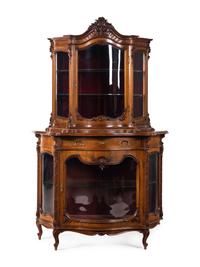 A Rococo Revival Carved Walnut Corner Vitrine Cabinet