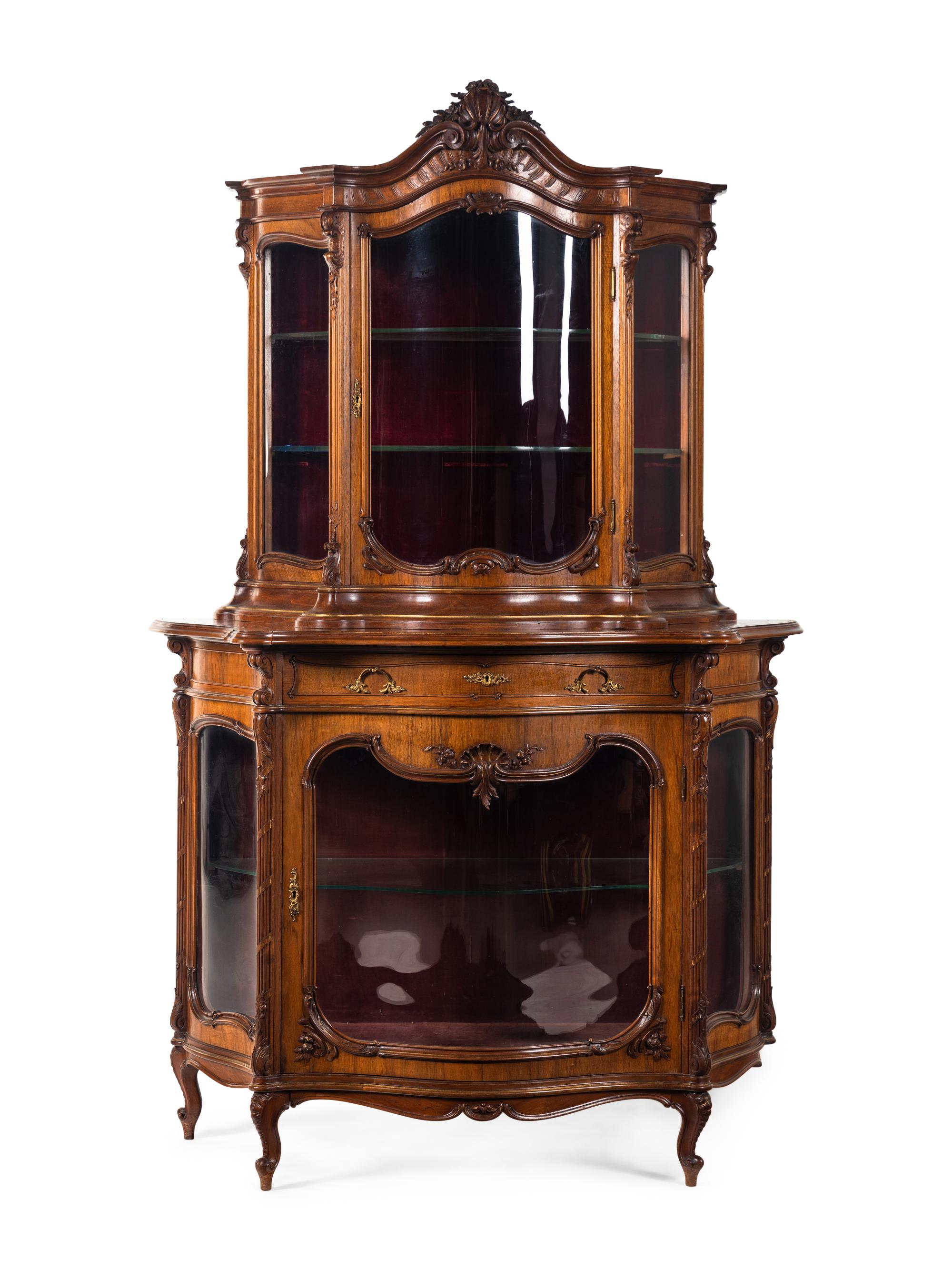 A Rococo Revival Carved Walnut Corner Vitrine Cabinet