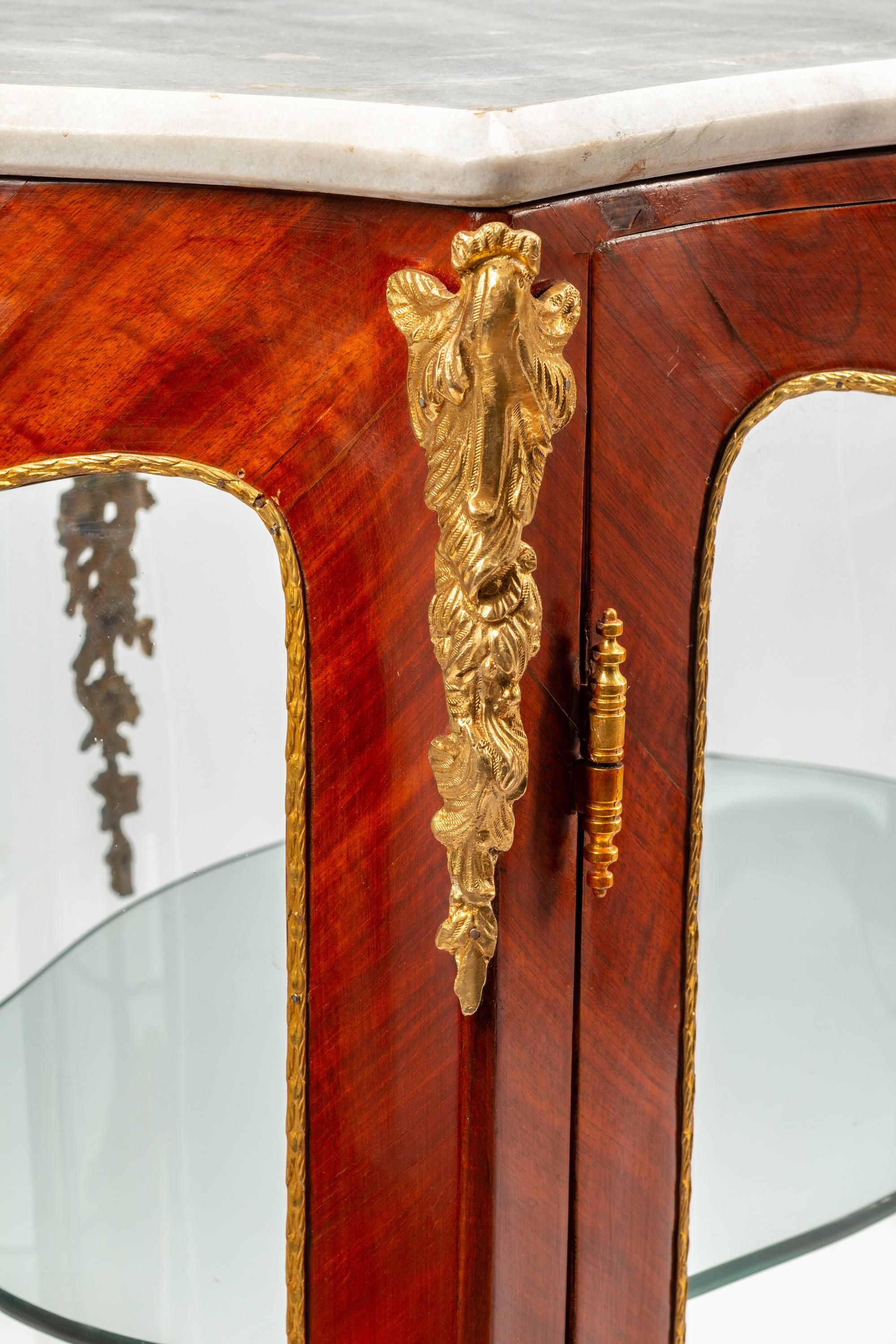 A Pair of Louis XV Style Gilt Bronze Mounted Marble-Top Vitrine Cabinets