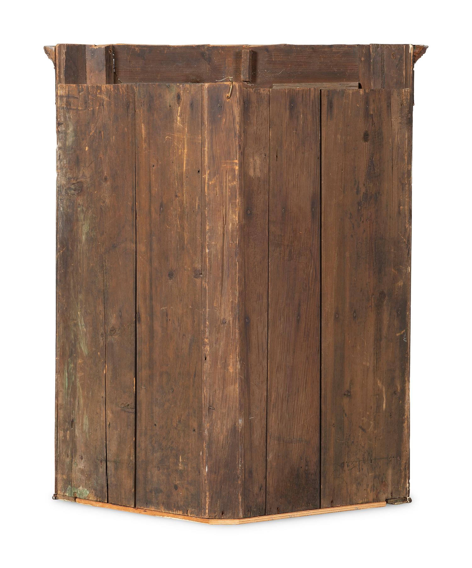 A Chippendale Figured and Paneled Mahogany Hanging Corner Cabinet