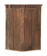 A Chippendale Figured and Paneled Mahogany Hanging Corner Cabinet
