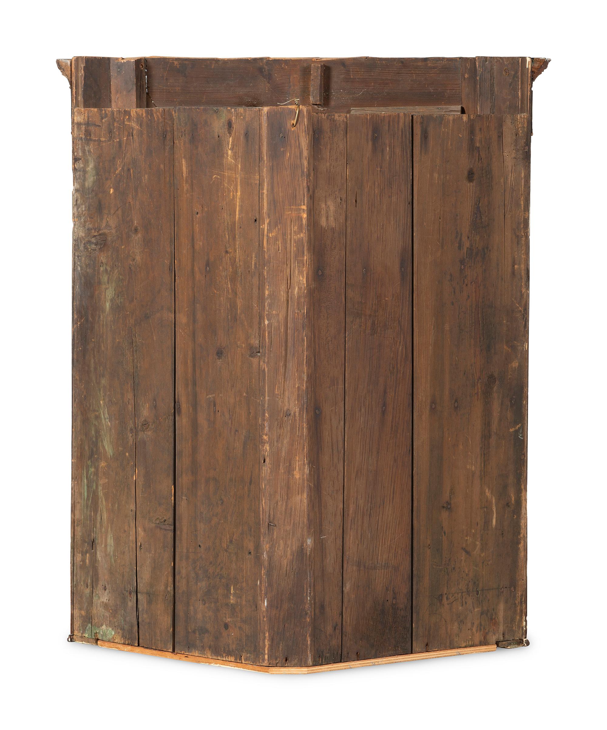 A Chippendale Figured and Paneled Mahogany Hanging Corner Cabinet