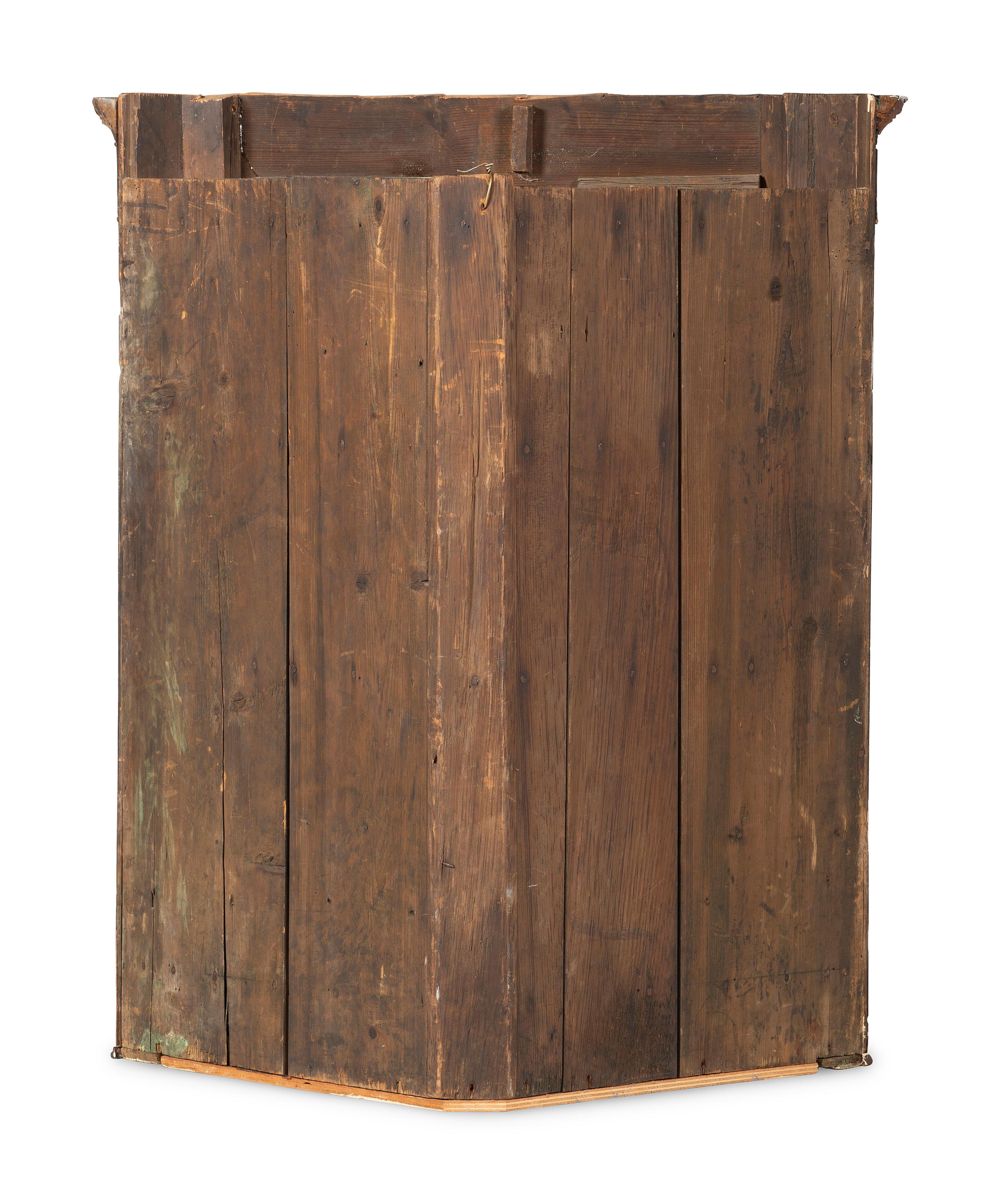 A Chippendale Figured and Paneled Mahogany Hanging Corner Cabinet