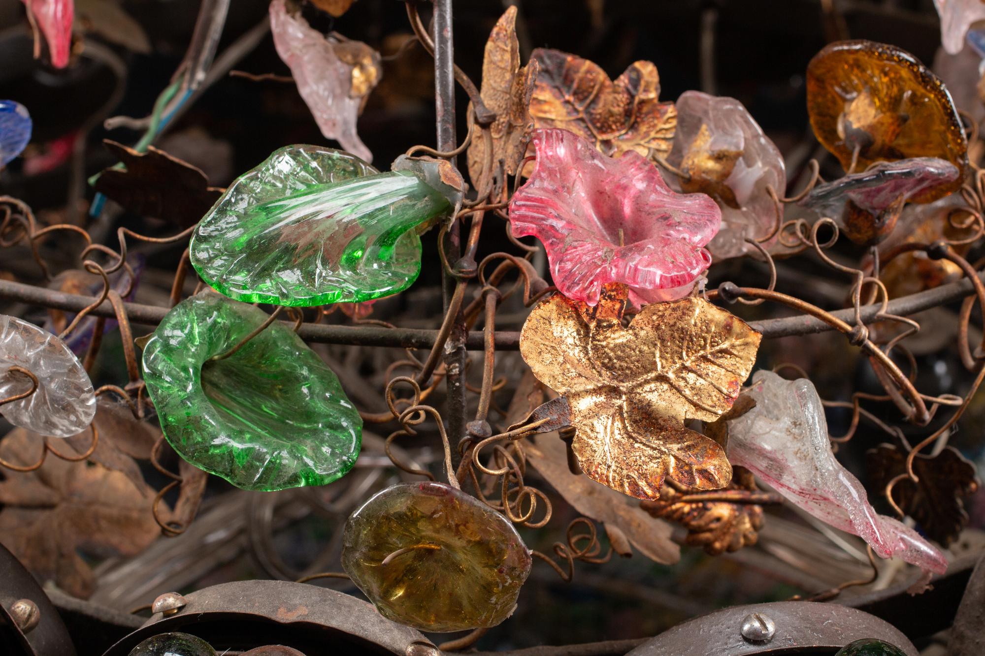 An Unusual Continental Wrought-Iron, Tole and Colored Glass Sixteen-Light Chandelier