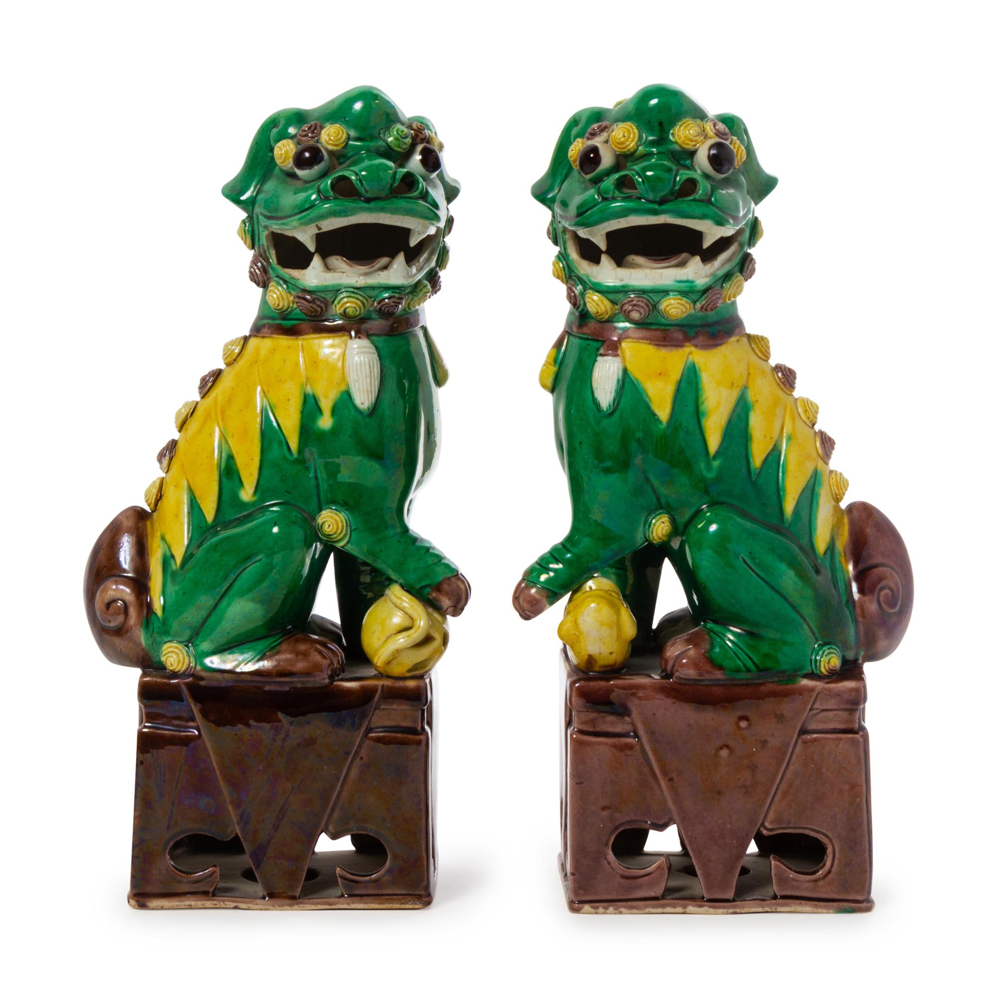 A Pair of Chinese Sancai Glazed Porcelain Figures of Fu Lions