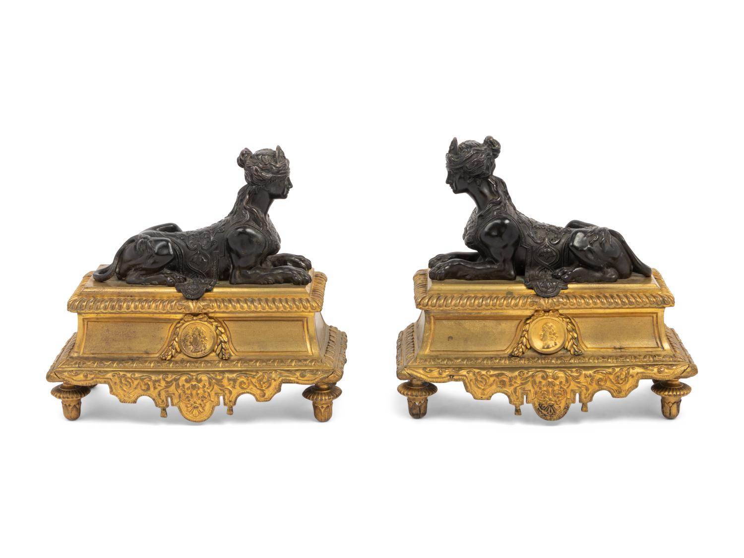 A Pair of Louis XVI Style Gilt and Patinated Bronze Chenets with Sphinxes