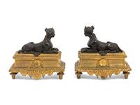 A Pair of Louis XVI Style Gilt and Patinated Bronze Chenets with Sphinxes