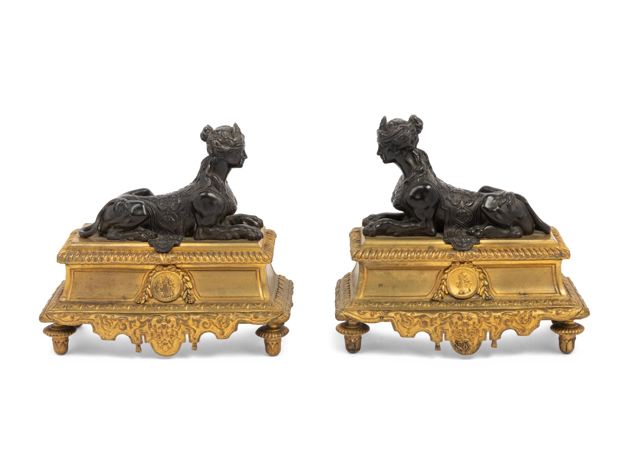 A Pair of Louis XVI Style Gilt and Patinated Bronze Chenets with Sphinxes