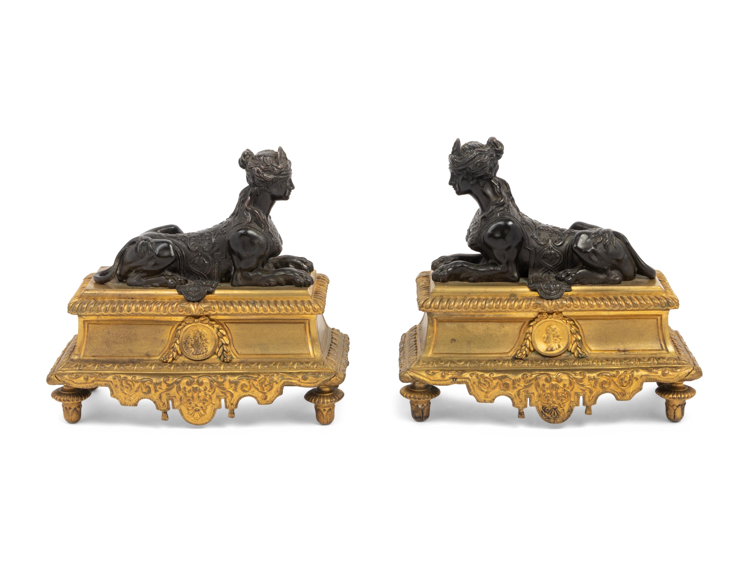 A Pair of Louis XVI Style Gilt and Patinated Bronze Chenets with Sphinxes