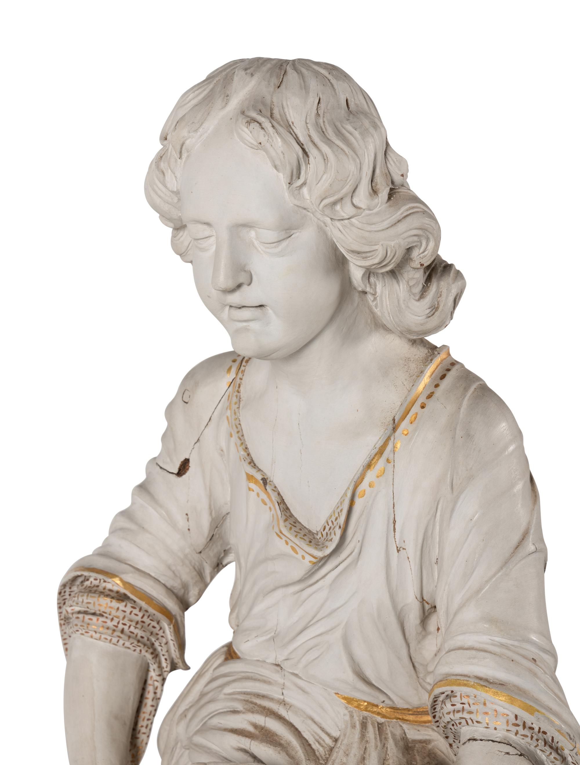 A Set of Three Carved, Painted and Parcel Gilt Wood Figures