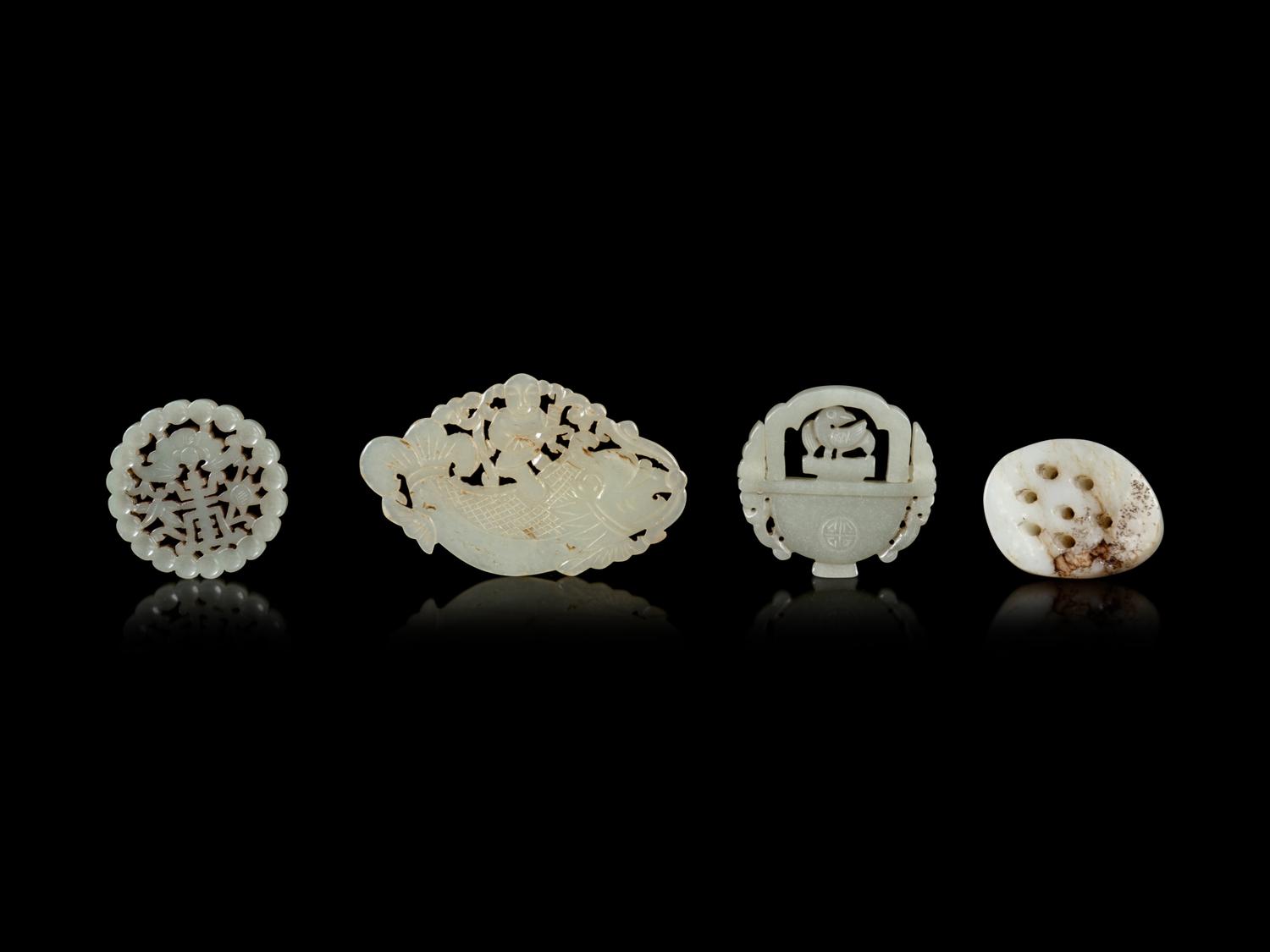 Four Chinese Jade Reticulated Pendants