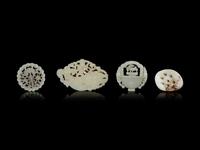 Four Chinese Jade Reticulated Pendants