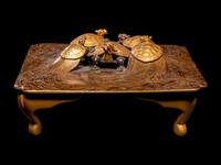 A Japanese Gold and Black Lacquer 'Dragon Turtle' Square Stand