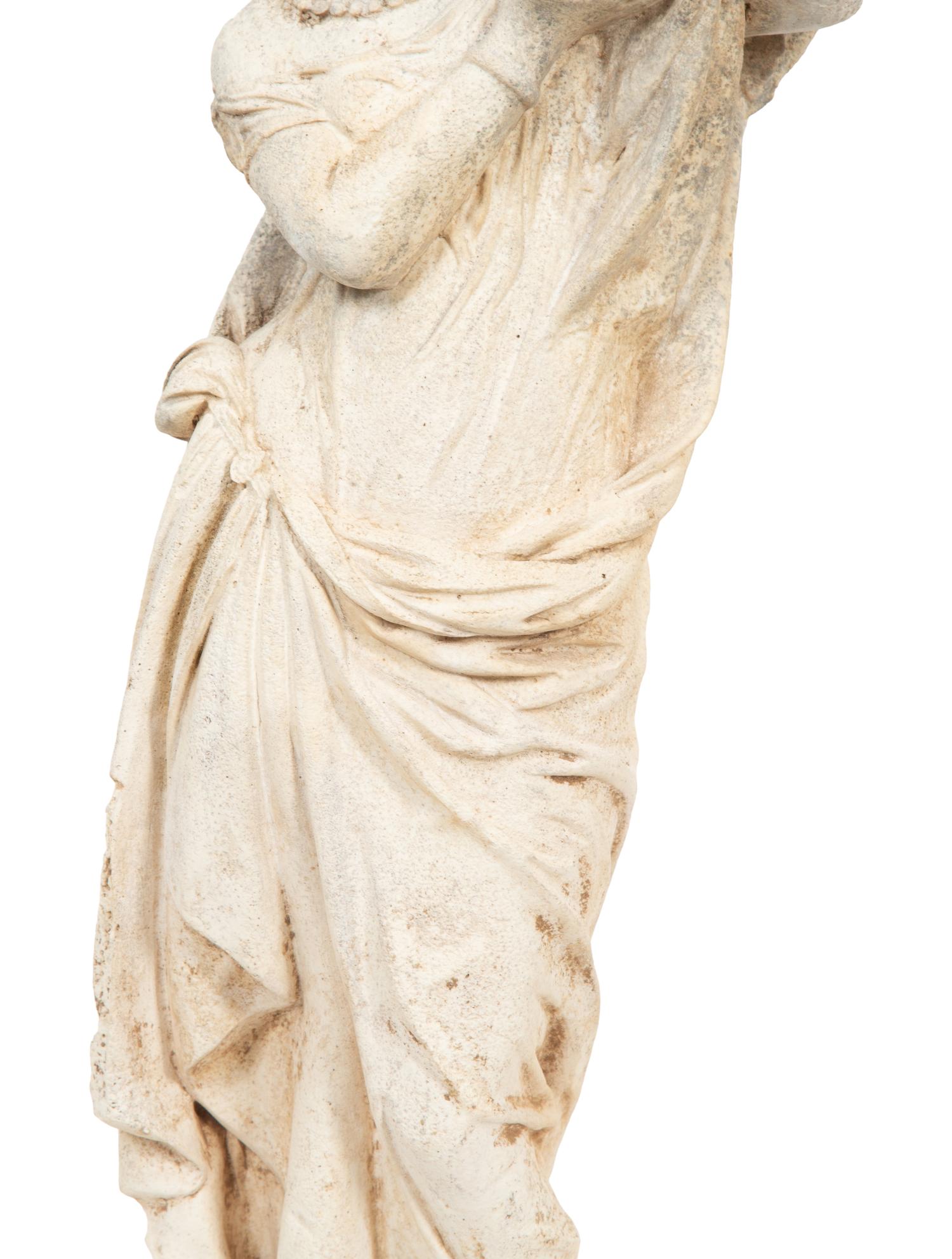 A Cast Composition Figure of a Water Maiden