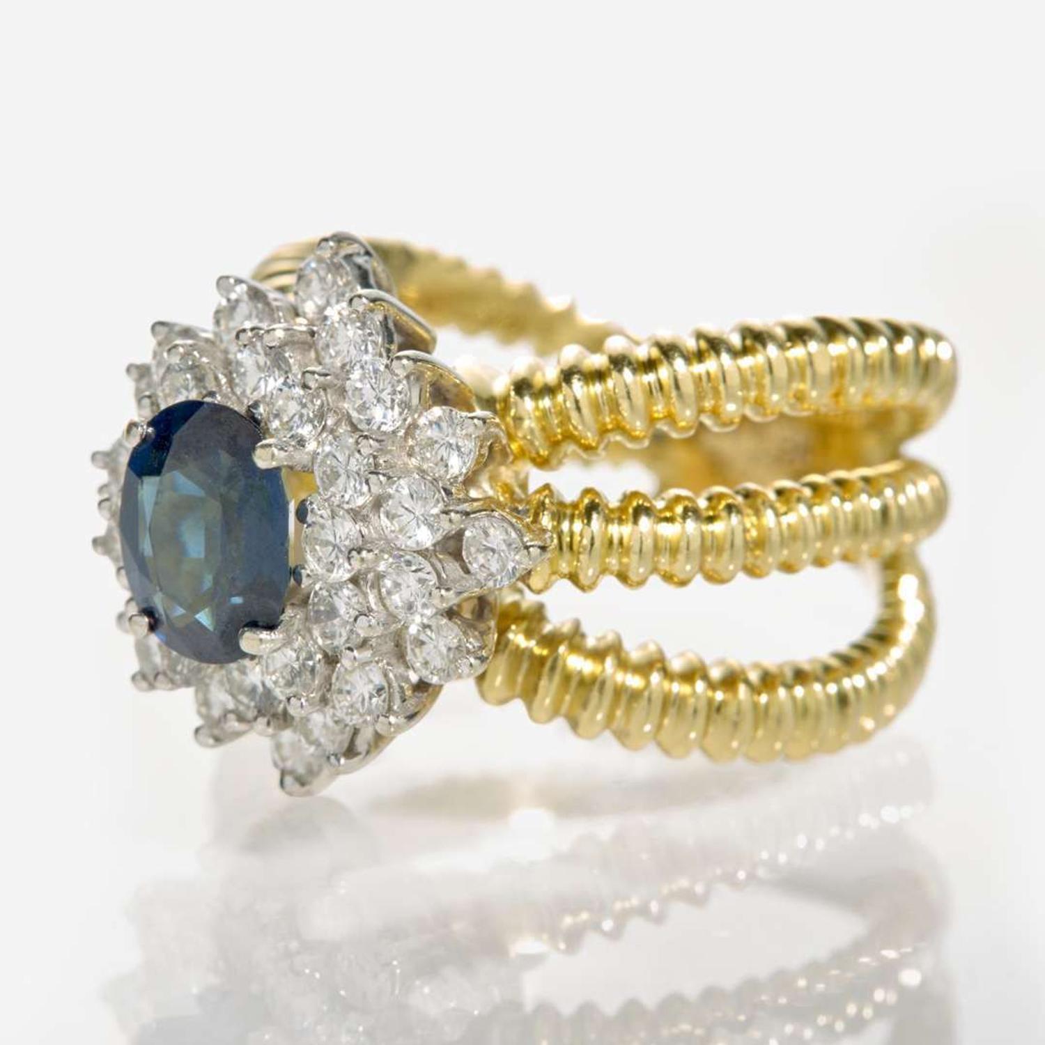 An 18K Yellow Gold, Sapphire, and Diamond Ring