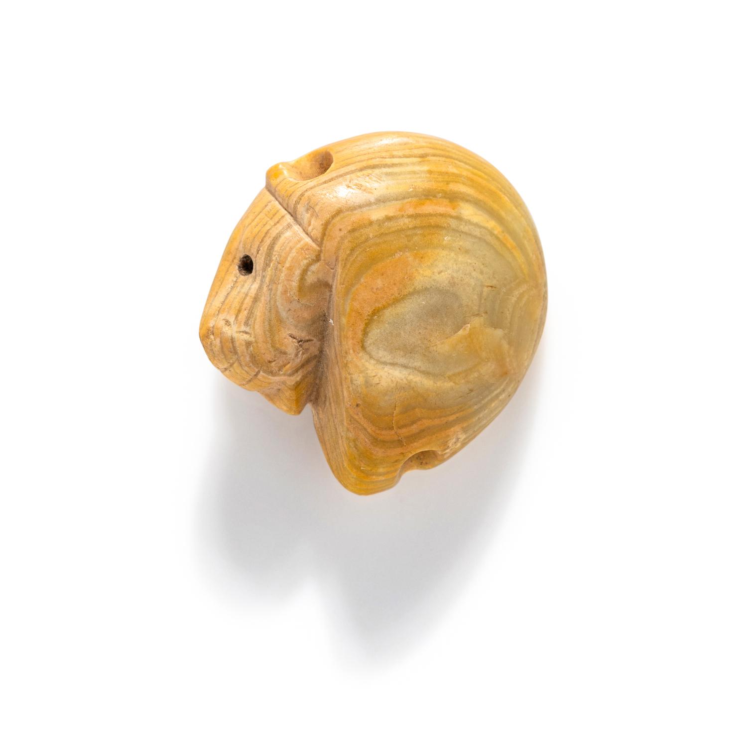 A Mesopotamian Yellow Jasper Stamp Seal with the Head of a Lion