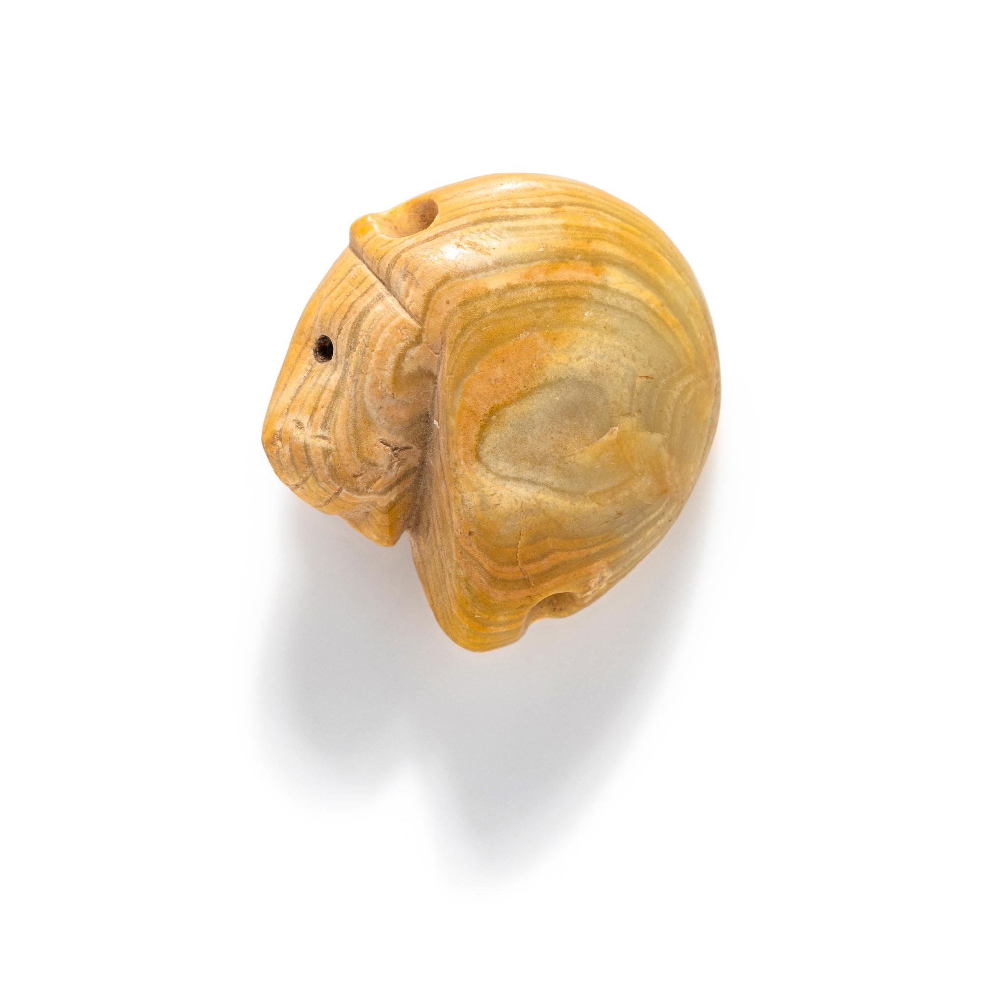 A Mesopotamian Yellow Jasper Stamp Seal with the Head of a Lion