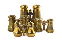 Four Pairs of Brass Clad Opera Glasses, Width of widest 5 1/8 inches.