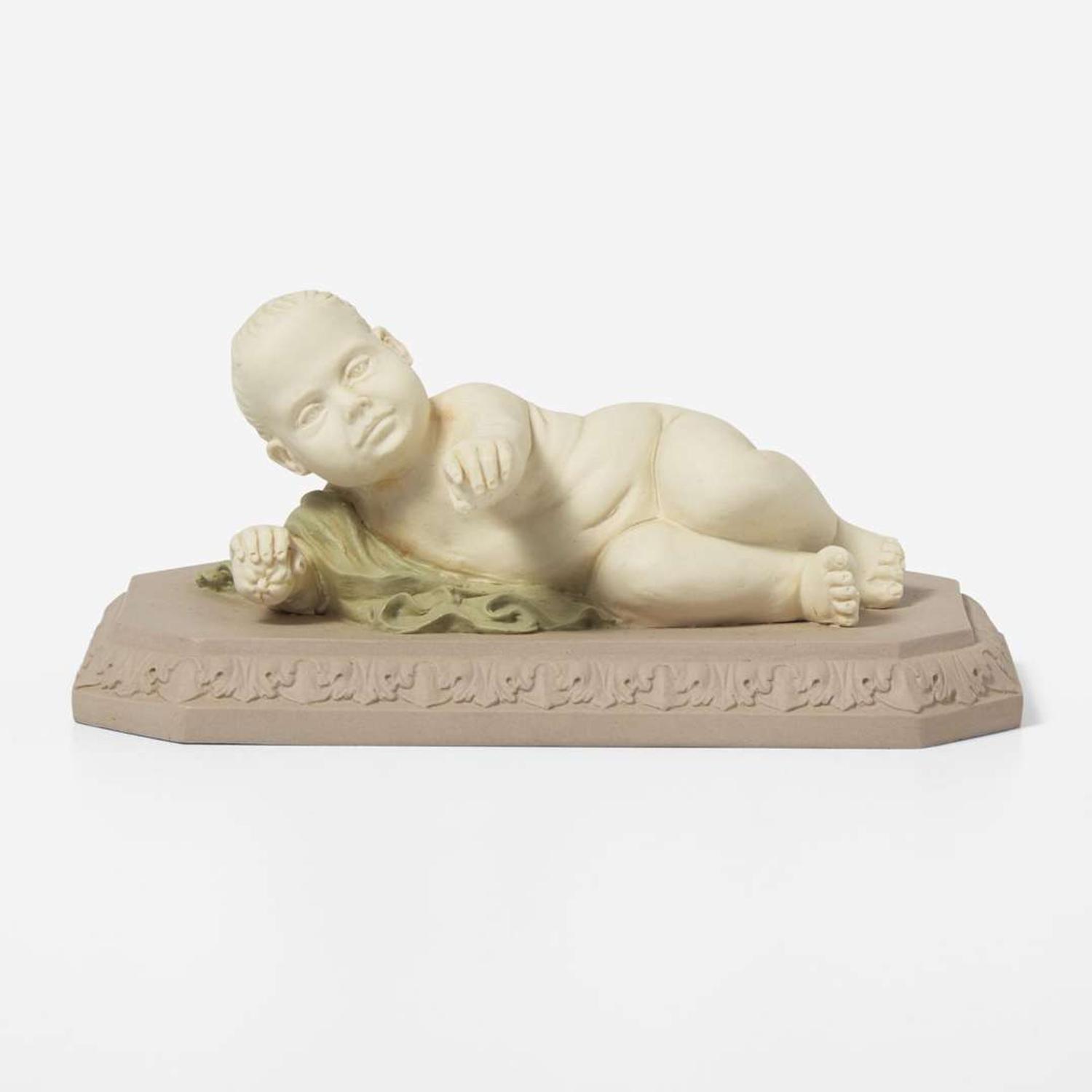 A Wedgwood Tricolor Jasperware Figure of a Reclining Infant UK, circa 1800