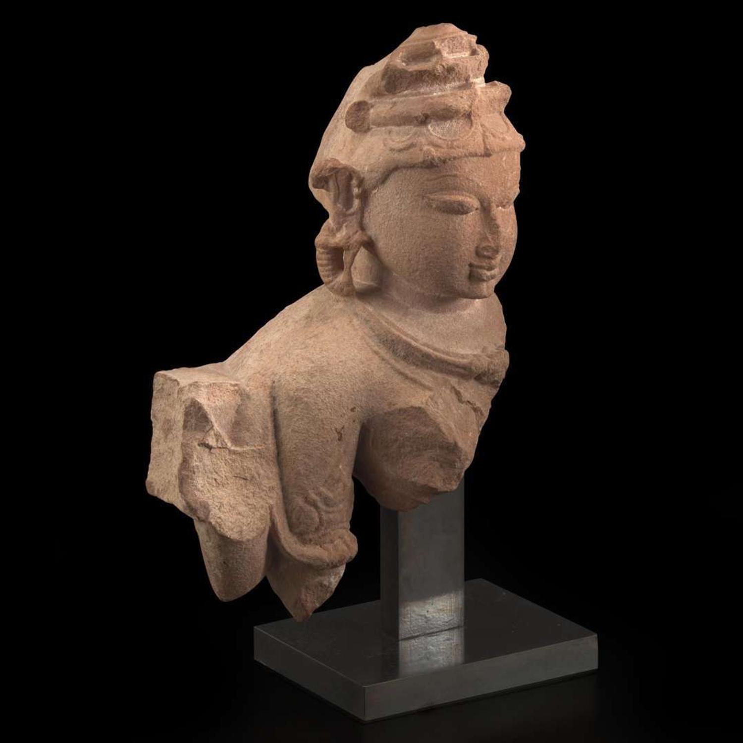 An Indian carved pinkish-buff sandstone bust of a female deity 砂岩雕女神像 Uttar Pradesh, 10th / 11th century ??? ??????