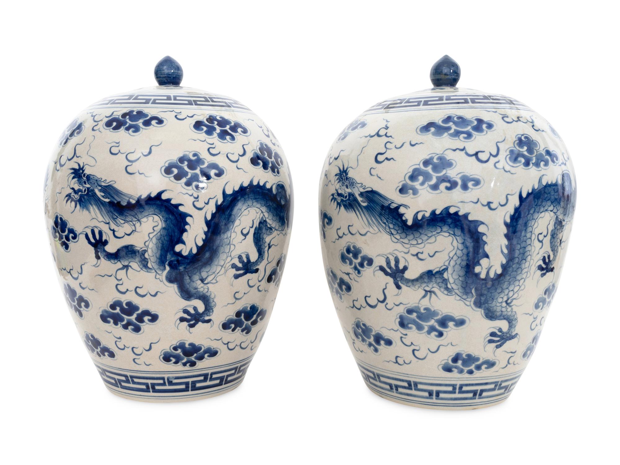 A Pair of Large Chinese Porcelain Blue and White Dragon Lidded Urns