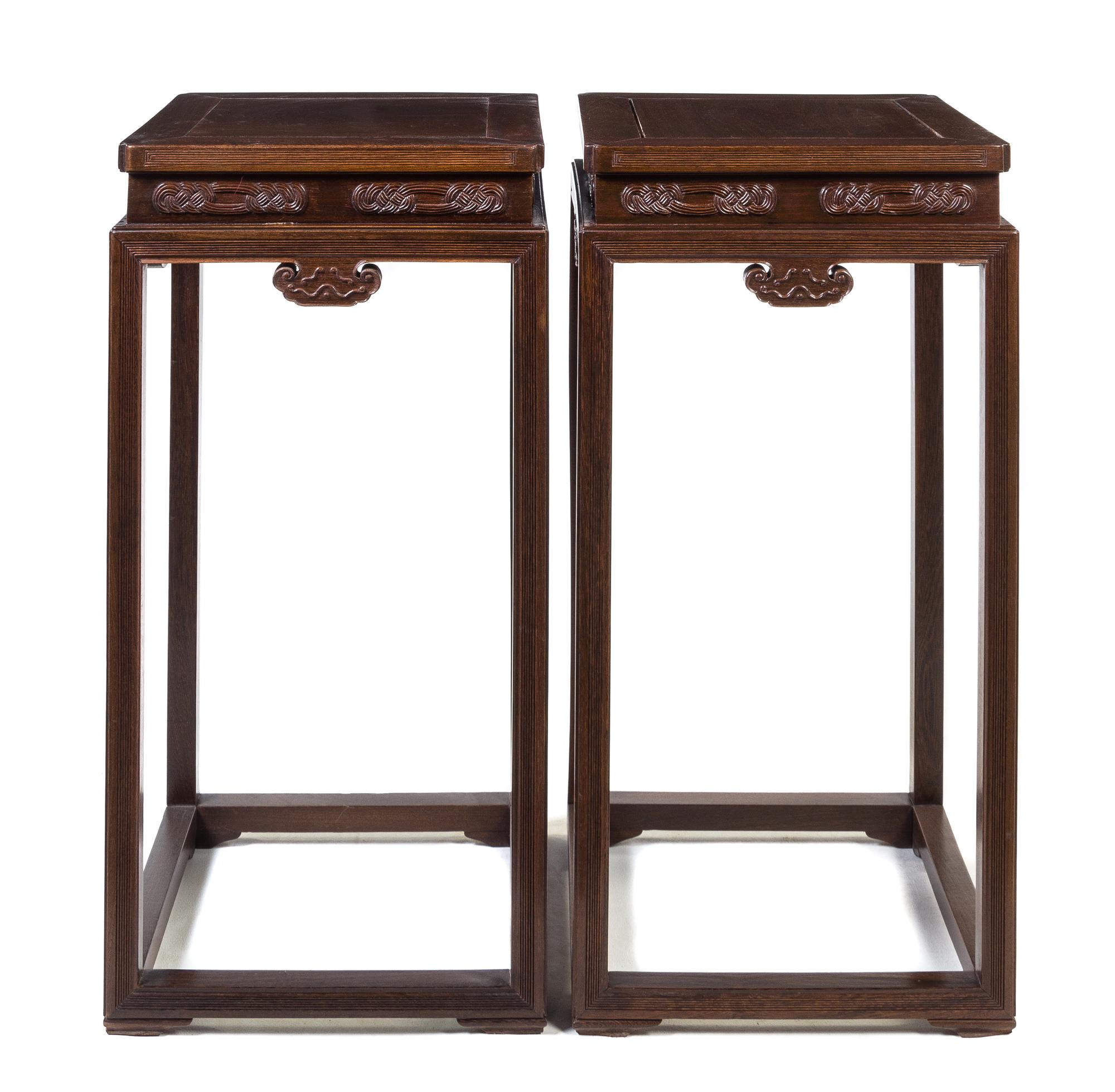 A Pair of Chinese Jichimu Wood Side Tables Height 35 x width 17 1/4 x depth 1/4 inches.