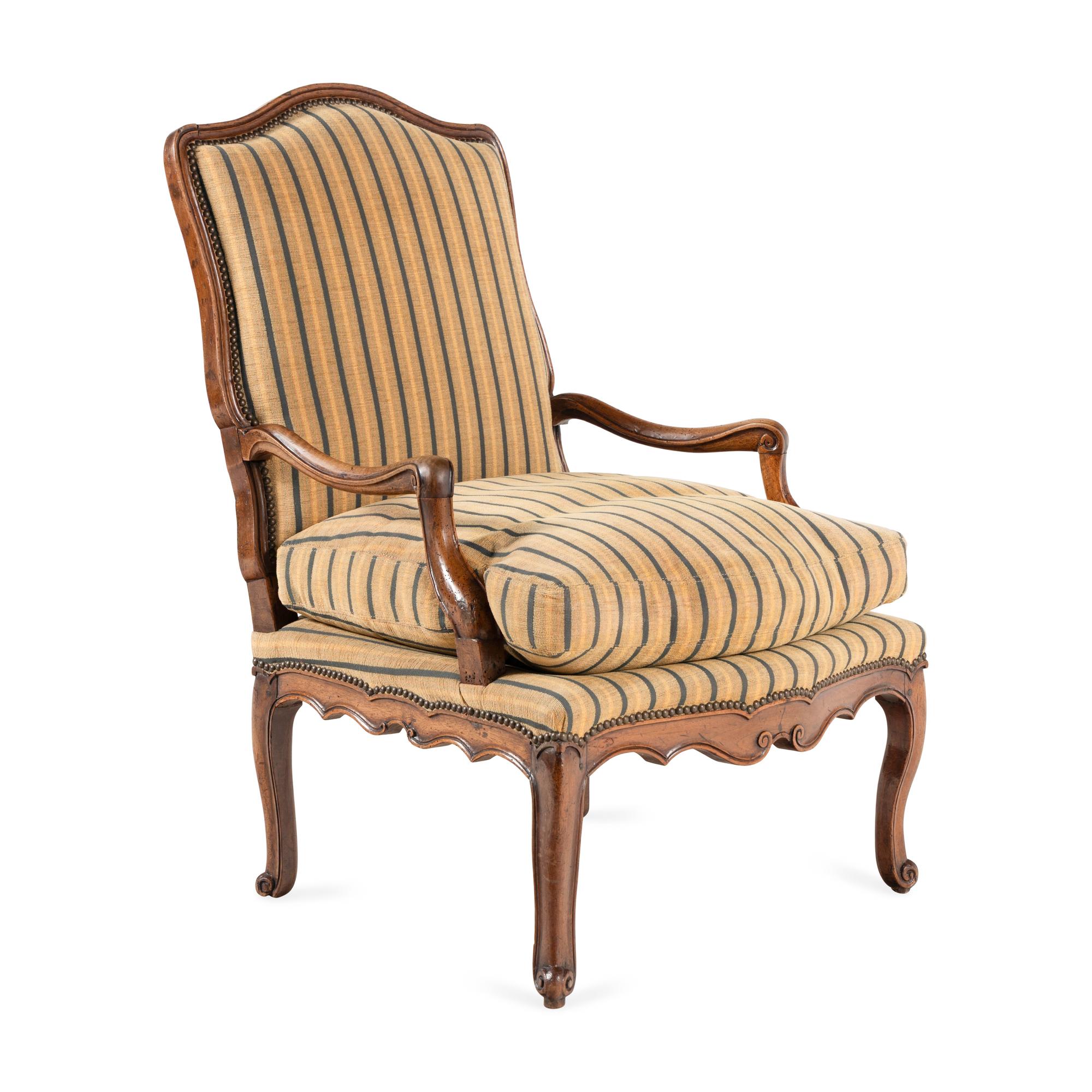 A Louis XV Carved Walnut Fauteuil