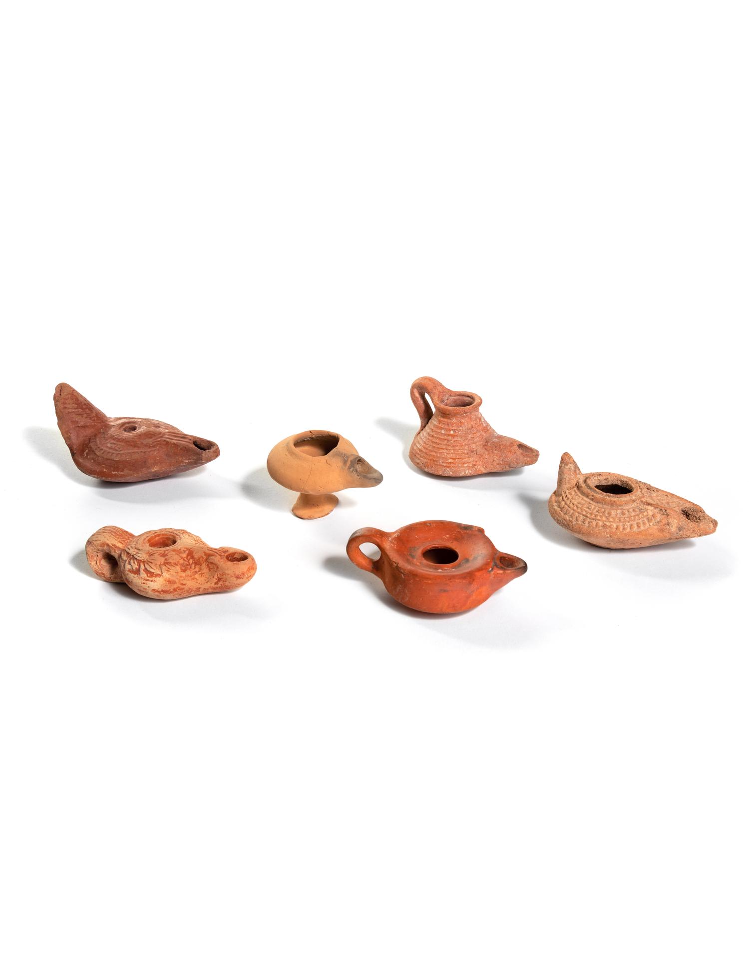 Six Roman Molded Terra Cotta Oil Lamps