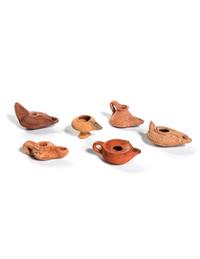 Six Roman Molded Terra Cotta Oil Lamps