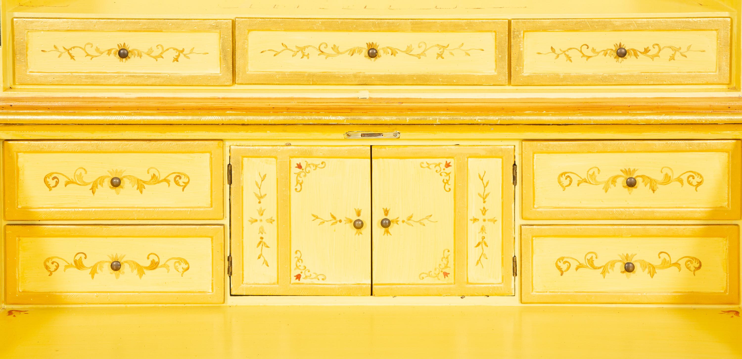 A Venetian Style Painted and Parcel Gilt Bureau Cabinet