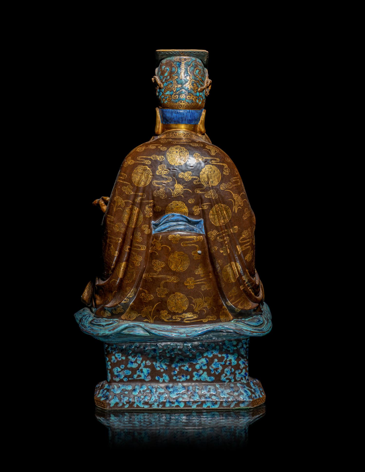 A Chinese Gilt Highlighted Robin's Egg Glazed Porcelain Figure of a Daoist Immortal