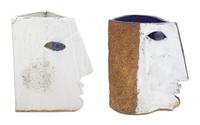 A Pair of Glazed and Painted Ceramic Face-Form Candleholder Height of largest 11 inches. — 20TH CENTURY