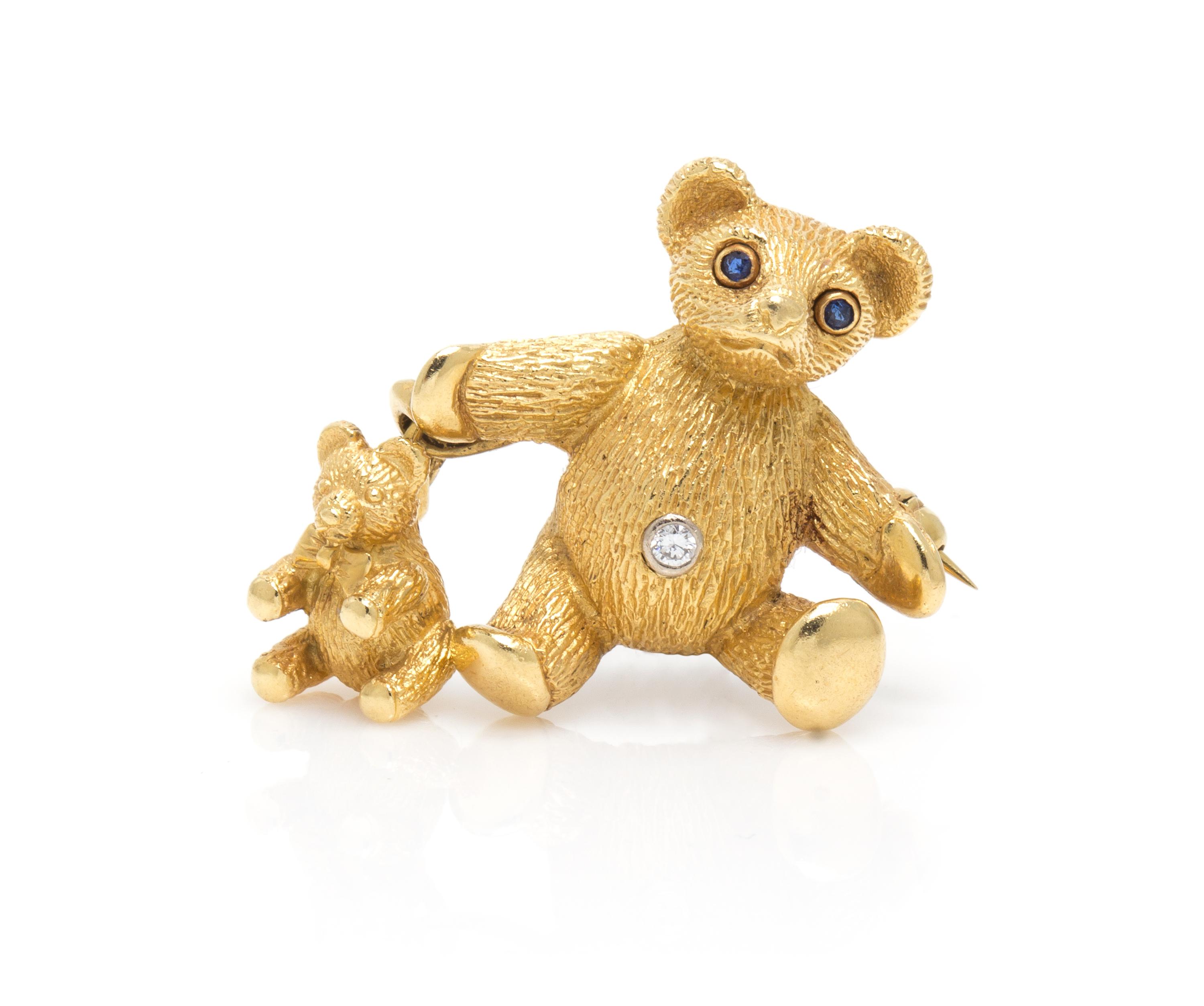 An 18 Karat Yellow Gold, Sapphire and Diamond Teddy Bear and Bear Charm Brooch, Tiffany & Co., Circa 1989, 5.20 dwts.