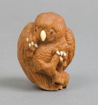 A Japanese Wood Netsuke of a Bird, Height 1 3/4 inches.