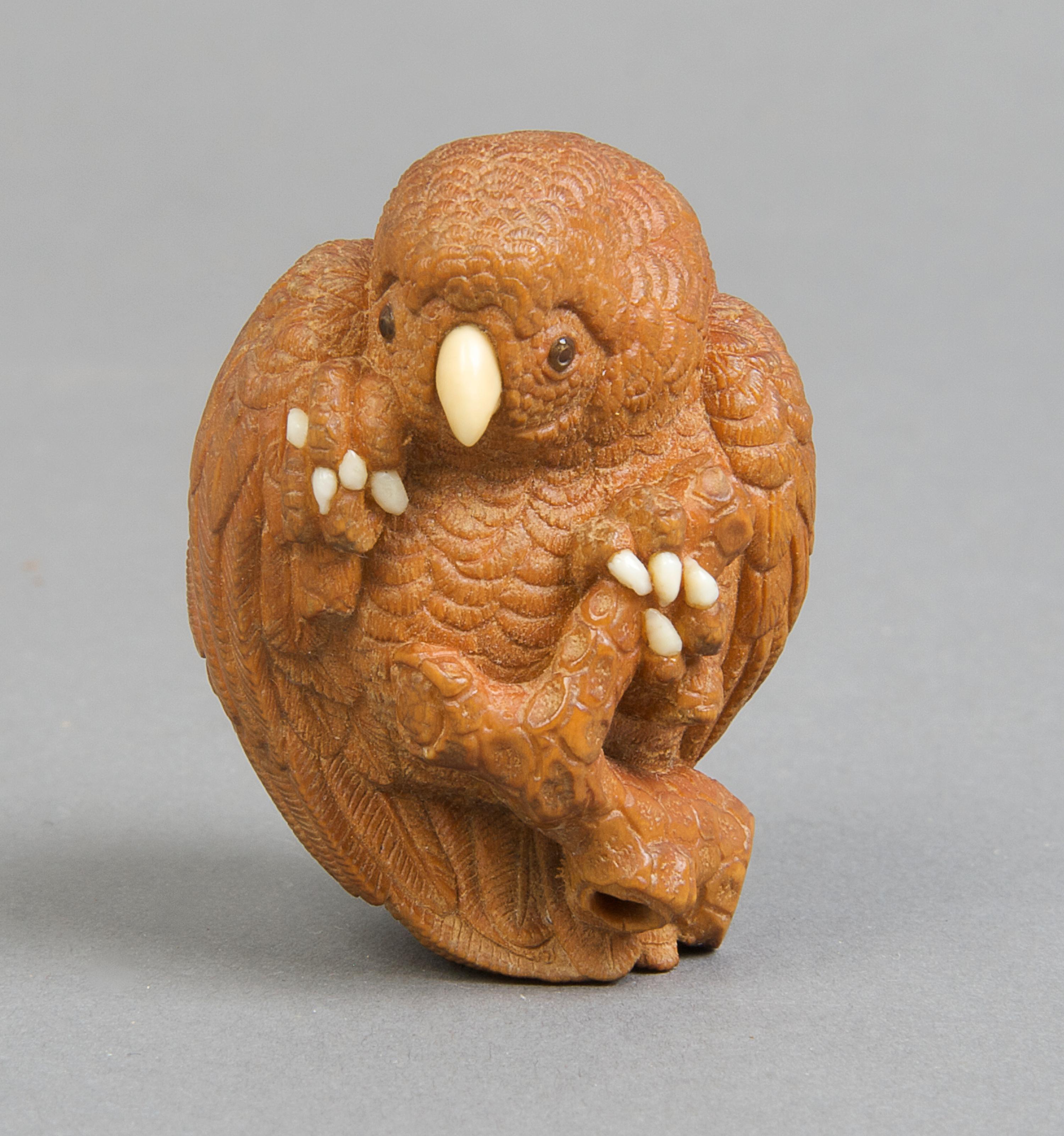 A Japanese Wood Netsuke of a Bird, Height 1 3/4 inches.