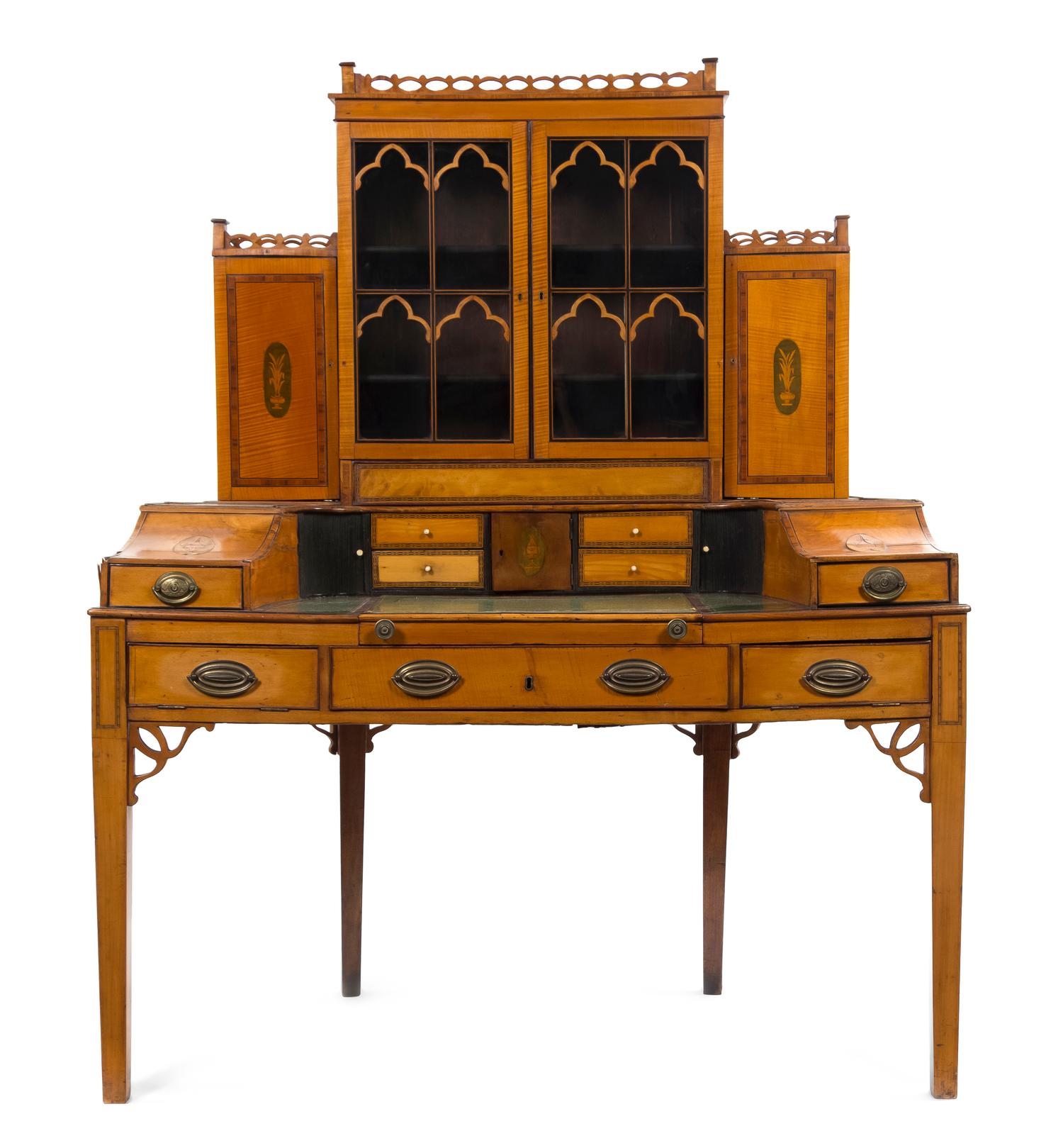 An Edwardian Satinwood and Marquetry Carlton Desk, Height overall 60 3/4 x width 49 x depth 24 inches.