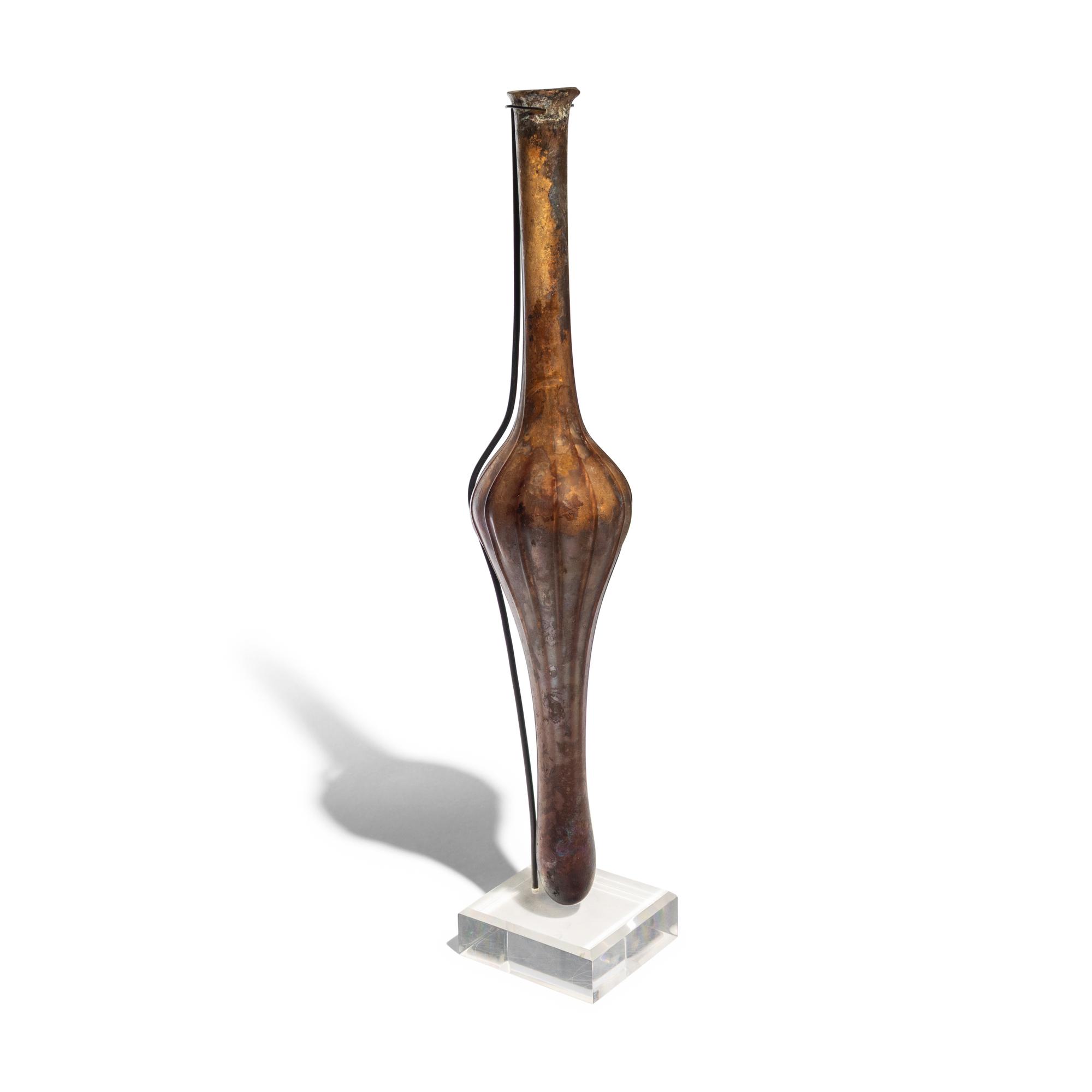 A Roman Aubergine Glass Unguentarium