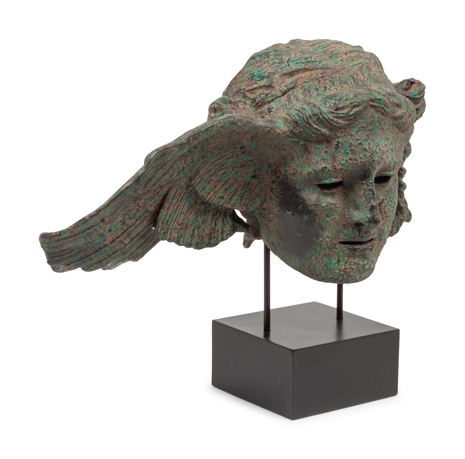 A Patinated Composition Head of Hypnos, After the Antique