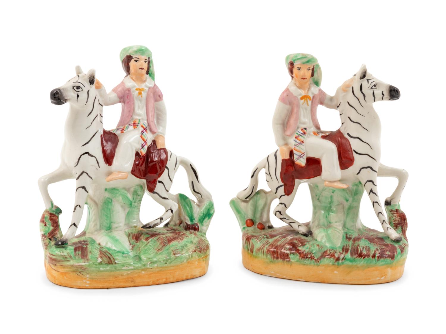 A Pair of Staffordshire Style Figural Groups