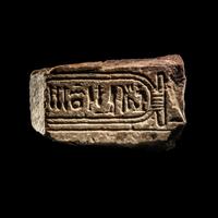An Egyptian Limestone Fragment with Cartouche of Queen Nefertiti