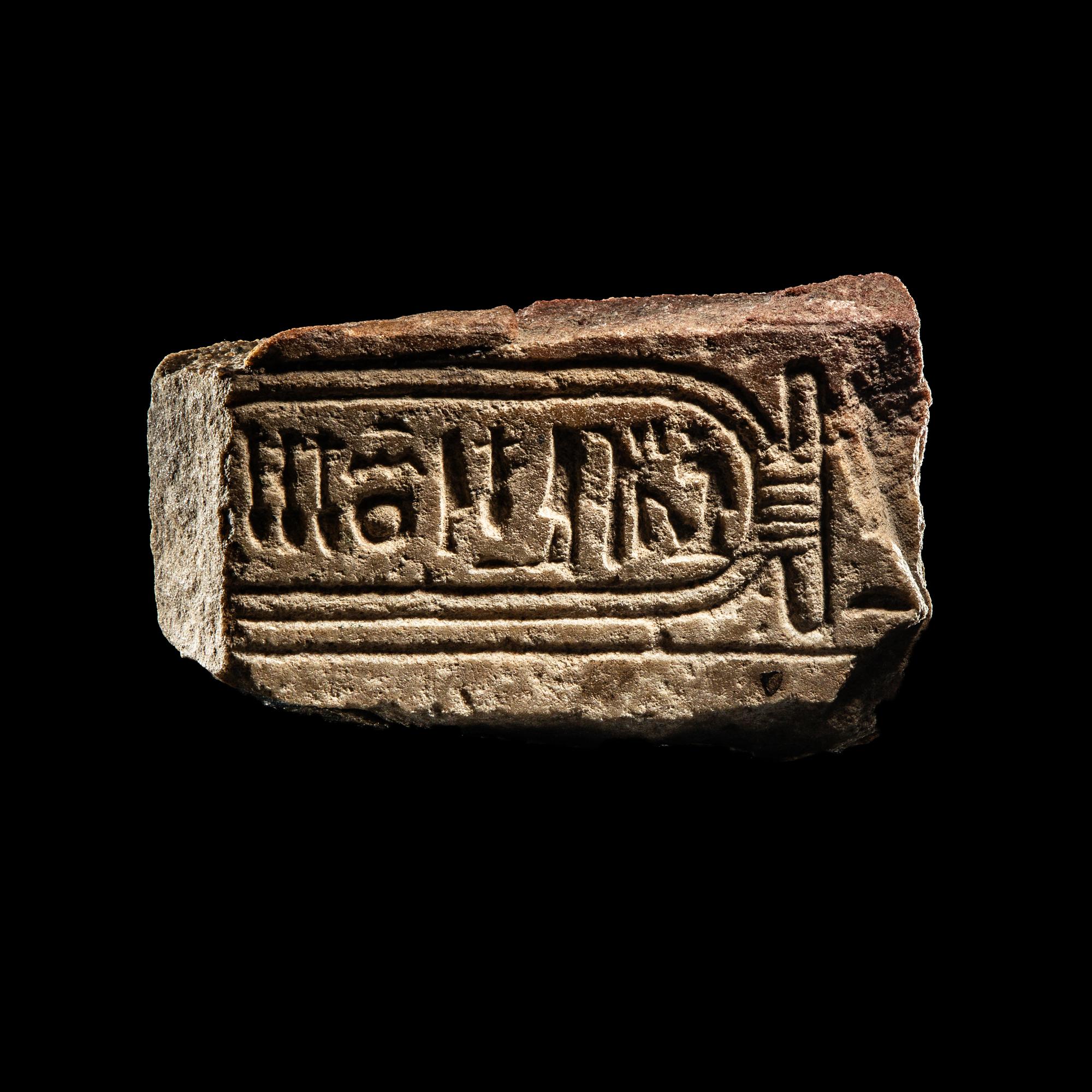 An Egyptian Limestone Fragment with Cartouche of Queen Nefertiti