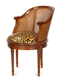 A Louis XVI Style Caned Bureau Chair