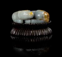 A Grey and Russet Jade Figure of a Recumbent Dog Length 3 inches.