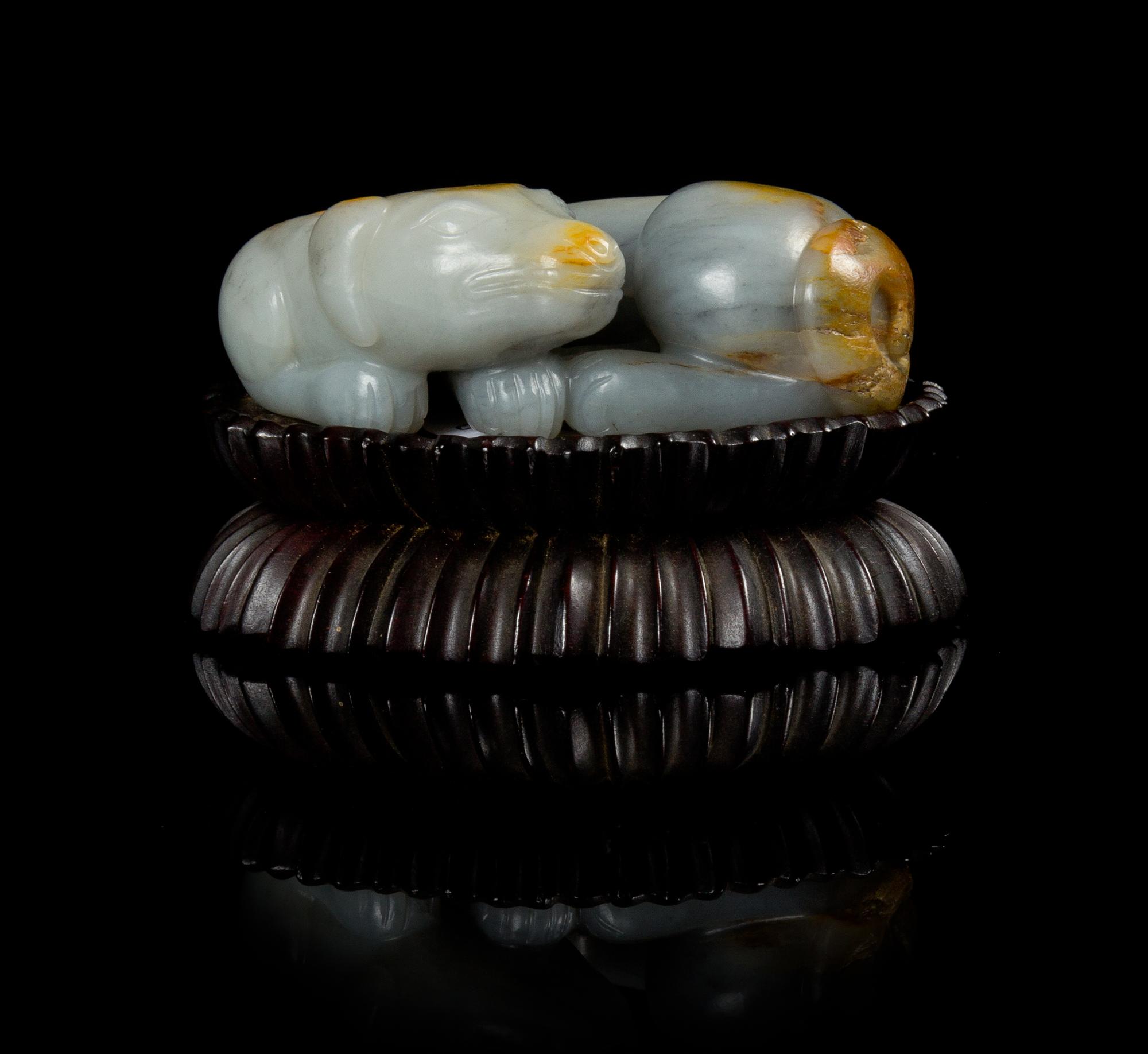 A Grey and Russet Jade Figure of a Recumbent Dog Length 3 inches.