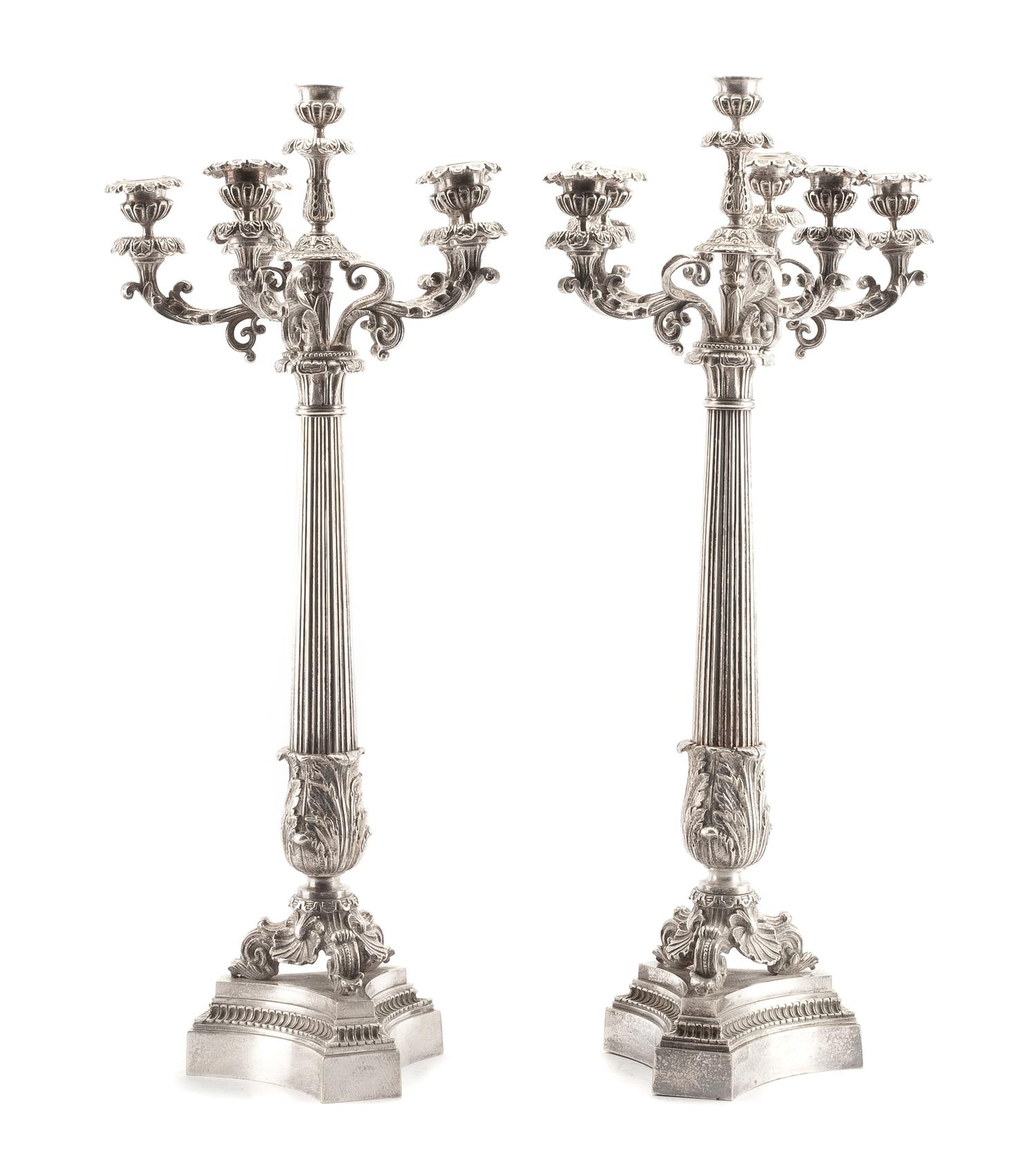 A Pair of French Silvered Bronze Six-Light Candelabra, 19th Century, each tapering stem of columnar form with acanthus leaves, raised o